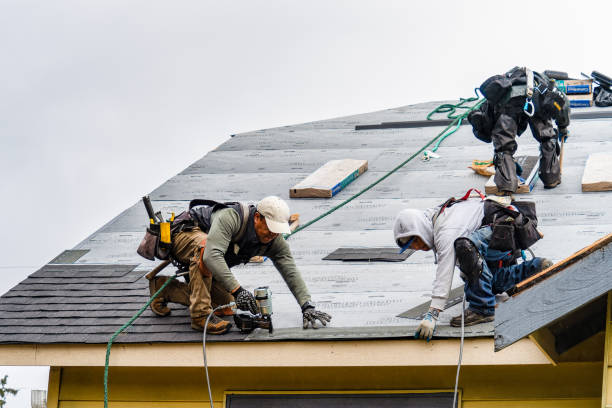 Professional Gutter Installation technician working in Milford, MA
